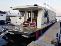 2002 KENCRAFT 48 FOOT HOUSEBOAT FOR SALE IN THE BOBCAYGEON AREA NORTHEAST OF TORONTO, ONTARIO, CANADA.
